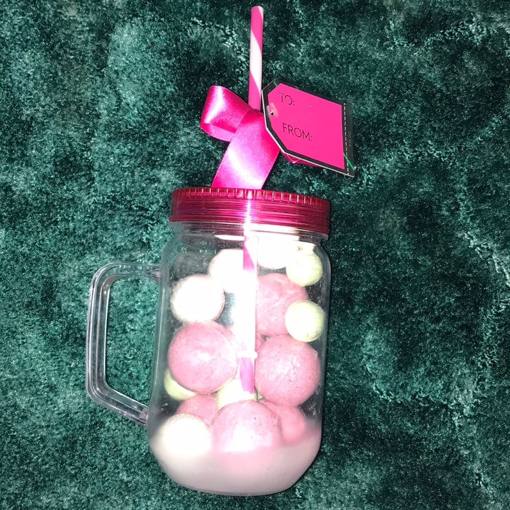 coffee mug and jar filled with bath bombs